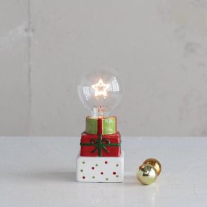 LED Star Shaped Filament Lightbulb  on Top of Holiday Packages