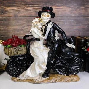 Love Never Dies Skeleton Bridal Couple On Bicycle With Basket of Roses Figurine