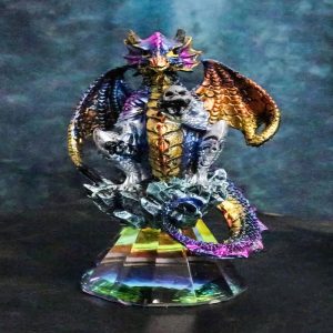 Iridescent Armored Rainbow Wyrmling Dragon Skull On Faux Crystal Prism Figurine