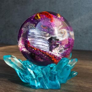 Purple Fossil Dragon Hatchling Sleeping in Crystal Acrylic Glass Egg Figurine