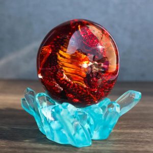Red Fossil Dragon Hatchling Sleeping in Faux Crystal Acrylic Glass Egg Figurine