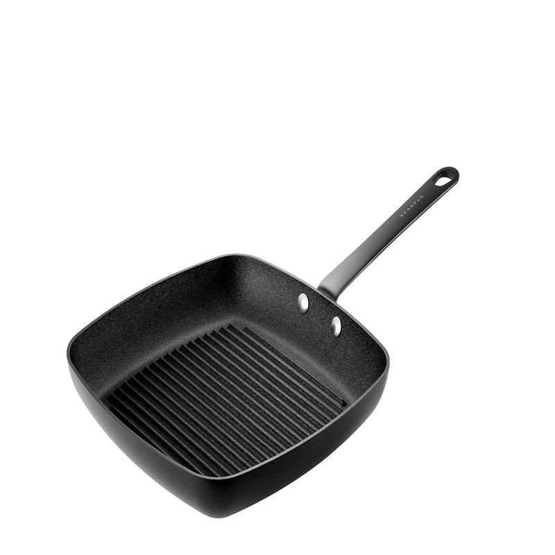 Grill indoors with style and precision using the Scanpan Black Edition 11-Inch Grill Pan. Features Stratanium nonstick, even heat distribution, and a sleek matte-black PVD handle for professional resu